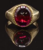A 9ct gold ring set with a synthetic ruby cabochon, size N, 4.4g