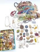 A collection of beaded necklaces including early Chinese plastic, millefiori, ivory, faux amber etc