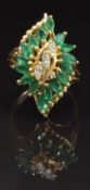 A 14k gold ring set with three marquise cut diamonds and 16 marquise cut emeralds, size P, 6g