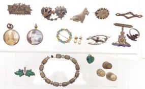 A collection of silver jewellery including Victorian brooches, Victorian locket set with