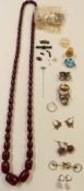 A cherry amber necklace, watches, two silver rings, 9ct gold mount, 0.3g etc