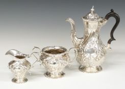 Victorian hallmarked silver three piece tea or coffee set with embossed decoration, London 1893/