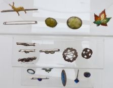A collection of silver brooches including enamel set, thistle, Robert Allison, butterfly wing,