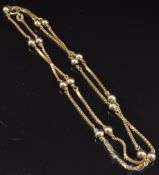 A 9ct gold necklace with sphere decorations, 6g, length 50cm