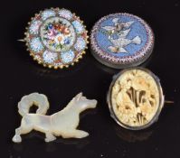 A micro mosaic brooch, a mother of pearl dog and a brooch set with carved ivory