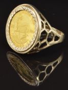A 9ct gold ring set with a South African coin, size W, 6.5g