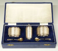 Cased retro three piece cruet set with bark effect decoration, Birmingham 1970/71, maker Deakin &
