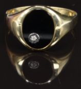 A 9ct gold ring set with onyx and a diamond, size 2, 4.1g