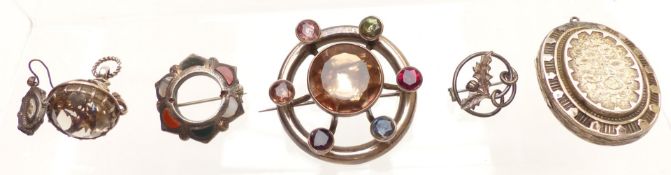 A group of silver jewellery including Victorian locket, brooch set with agate, fob and brooch set