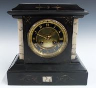 A 19thC French slate mantel clock with Roman chapter ring, beetle and poker hands and two train