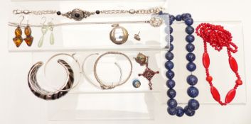 A collection of silver jewellery including bangles, pendants, earrings, locket,  lapis lazuli
