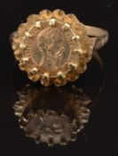 A 9ct gold ring set with a coin, size M, 3.4g