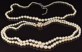 A double strand necklace of cultured pearls by JKa, the 9ct gold clasp set with pearls, and another
