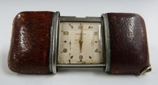 Movado vintage steel and leather travelling clock/ purse watch, 5 x 3.5cm when closed, 8 x 3.5cm