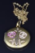 A yellow metal c1900 locket set with seed pearls and rubies in a floral design, 2.8cm, 7.8g