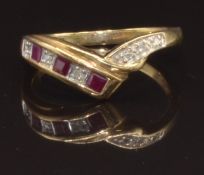 A 9ct gold ring set with square cut rubies and diamonds, size M, 2g