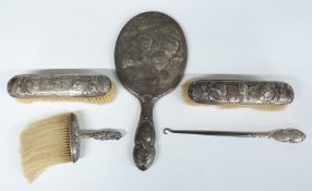 Three piece hallmarked silver dressing table set with decoration of Reynold's Angels, comprising