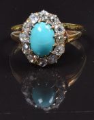 An 18ct gold ring set with a turquoise cabochon surrounded by old cut diamonds, size M, 3.4g, in