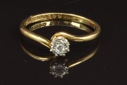 An 18ct gold ring set with a diamond in a platinum star setting, size R, 2.6g