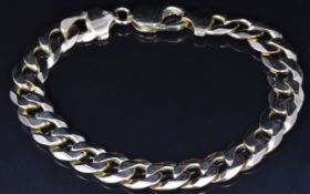A 9ct gold curb link bracelet, 28g
