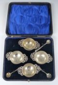 Cased Edward VII set of four hallmarked silver salts with pieced handles, Sheffeld 1901, maker