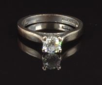 An 18ct white gold ring set with a round cut diamond of approximately 0.46ct, size L, 3.9g