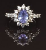 A 9ct white gold ring set with an amethyst and paste, size J, 2.4g