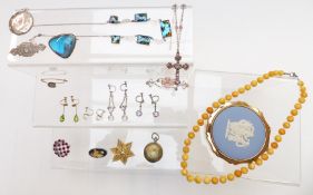 A collection of jewellery including vintage earrings, Victorian silver brooch, silver compact, amber