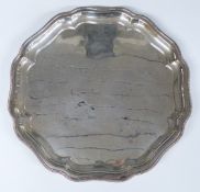 Walker & Hall modern hallmarked silver salver with shaped edge and raised on three feet,