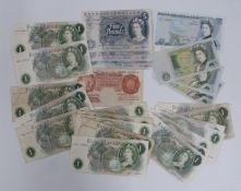 A collection of English circulated banknotes with a few near uncirculated crisp examples to