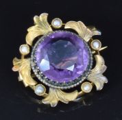 Edwardian gold pendant/ brooch set with a large round cut amethyst and seed pearls, 2.4cm, 4.5g