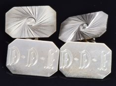 A pair of 9ct gold cufflinks with cut out and engine turned decoration, 6g