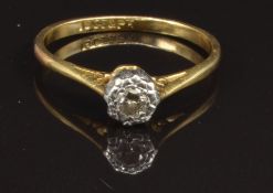 An 18ct gold ring set with a diamond in a platinum setting, size M, 1.8g