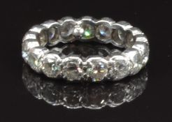 An 18ct white gold eternity ring set with 17 round cut diamonds each approximately 0.27ct, total