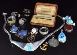 A 9ct gold anchor pendant, 0.5g and silver jewellery including Arts and Crafts pendant, a necklace