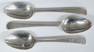 Three Georgian bright cut hallmarked silver table spoons comprising one pair London 1777, maker