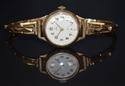 Tudor 9ct gold ladies wristwatch with inset subsidiary seconds dial, gold hands and Arabic numerals,