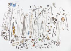 A collection of silver jewellery including chains, ingot, brooches, earrings, Victorian items, etc