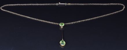 Edwardian 9ct gold necklace set with an oval and cushion cut peridot, 4.1g
