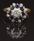 An 18ct gold ring set with diamonds and sapphires in a cluster, size M, 5.4g