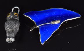 A white metal owl pencil by S. Mordan & Co and a Norwegian silver brooch set with blue enamel