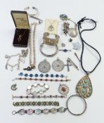 A collection of silver jewellery including pendants, bracelets, brooches, etc