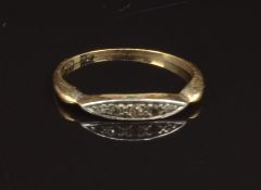 An 18ct gold ring set with diamonds, size M, 1.8g