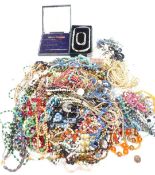 A collection of vintage beads including glass, mother-of-pearl, crystal etc