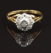 An 18ct gold ring set with diamonds in a platinum setting, size M, 2.8g