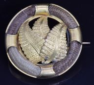 Victorian mourning brooch set with four sections of plaited hair and ferns to the centre, engraved