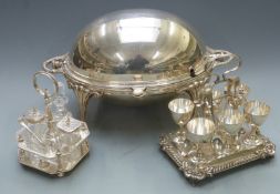 Silver plated food warmer with revolving lid, raised on gnurled feet, six place egg set and a four