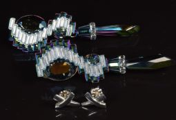 A pair of Swarovski iridescent glass drop earrings and a pair of silver earrings marked Tiffany