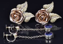 A pair of 9ct gold earrings set with an amethyst to each (1.1g) and a pair of 14ct gold earrings