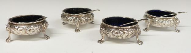 Victorian set of four hallmarked silver open salts with blue glass liners, London two 1863 and two